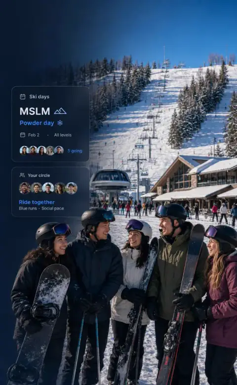 A group of skiers holding skis at a snowy resort base